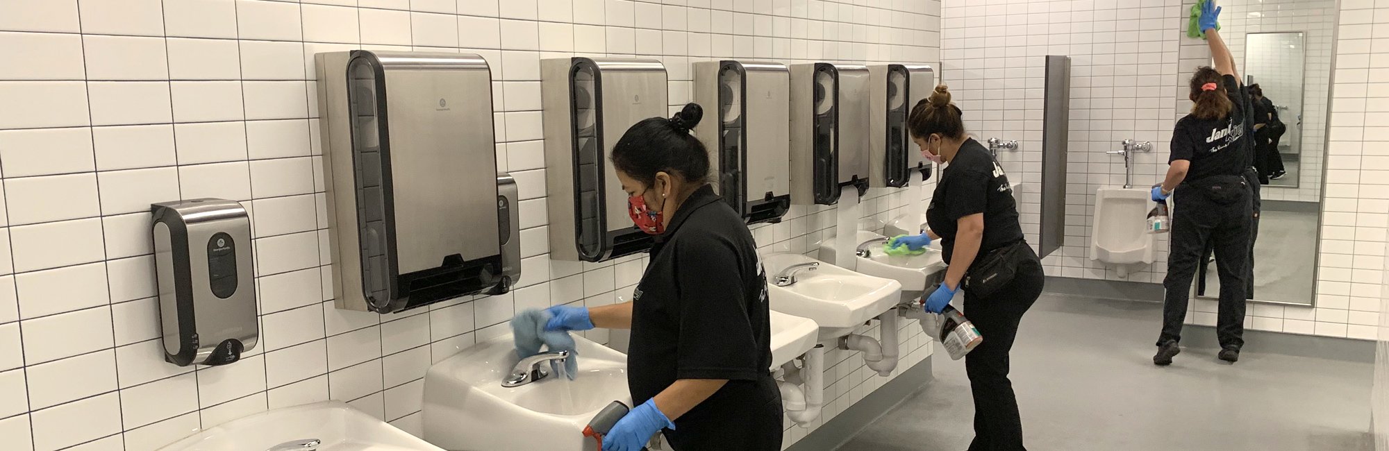 a group of people in a public restroom