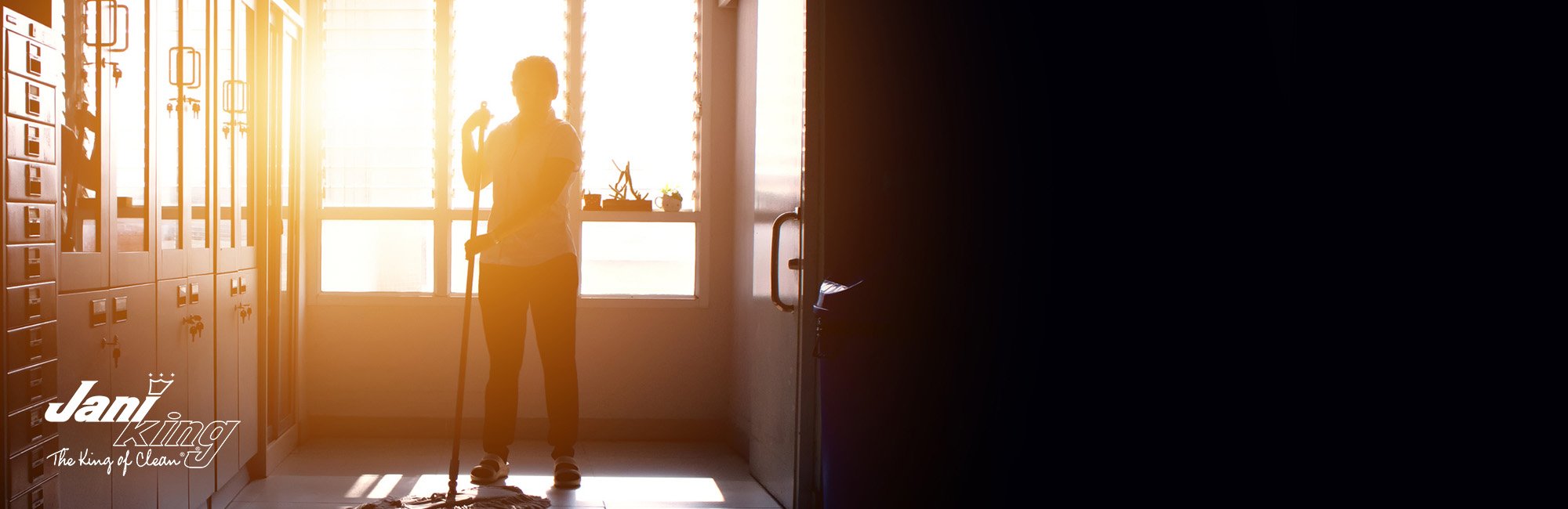 Janitor woman mopping floor in hallway office building or walkway after school and classroom silhouette work job with sun light background.