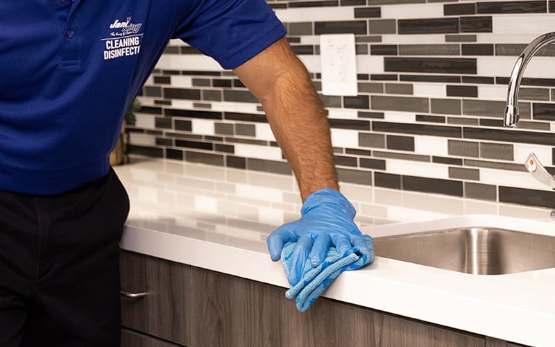 a man wearing blue gloves