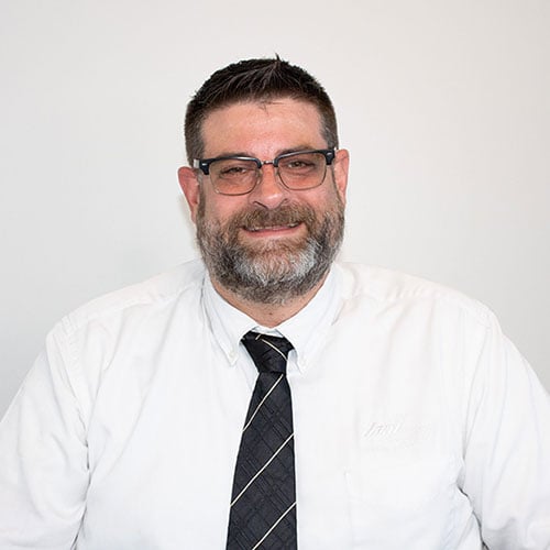 Profile headshot of DJ Woolf