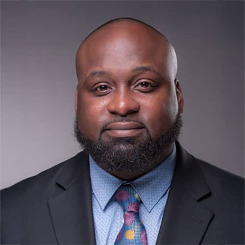 a man with a beard and a suit