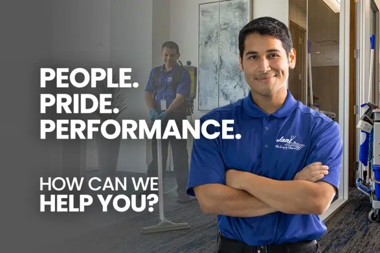 Jani-King employee vacuuming the carpet